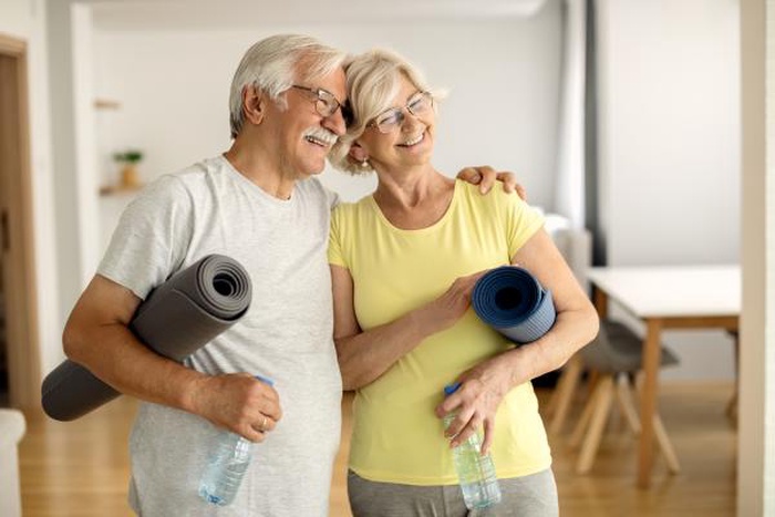 Senior couple ready for yoga workout together