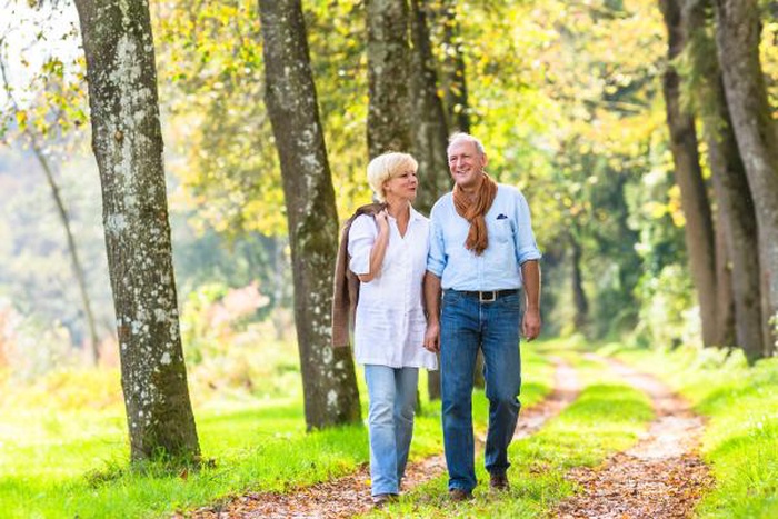 mature couple walking country trail Greenland New Hampshire Seacoast