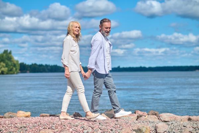 mature couple walking Sunapee Harbor Lake New Hampshire