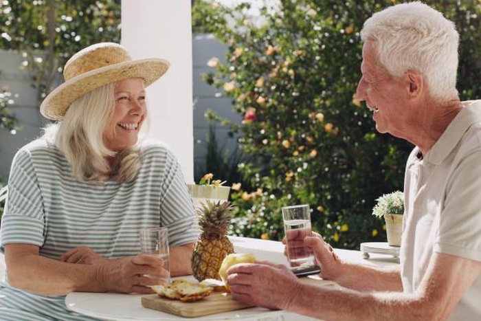 The senior couple chatted happily in the garden.