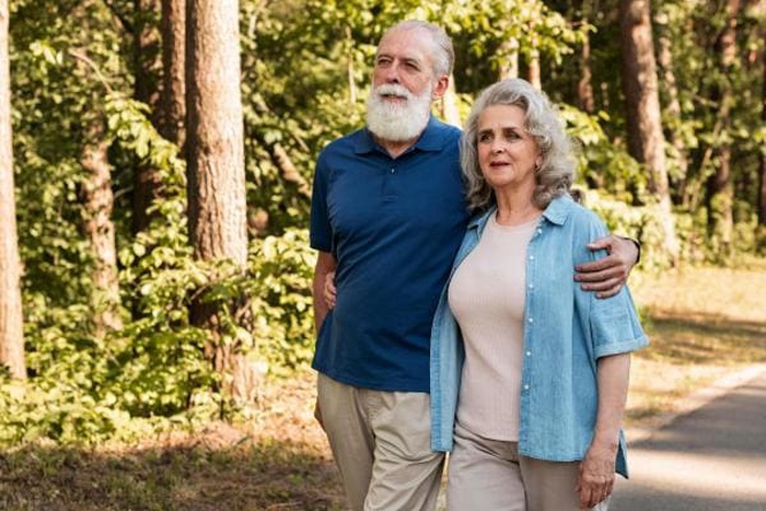 A sweet senior couple walking side by side on a gentle date