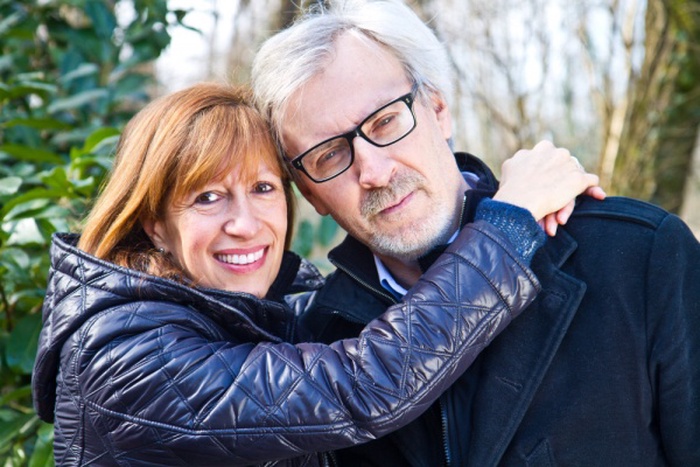 Cute middle aged couple embracing outdoors