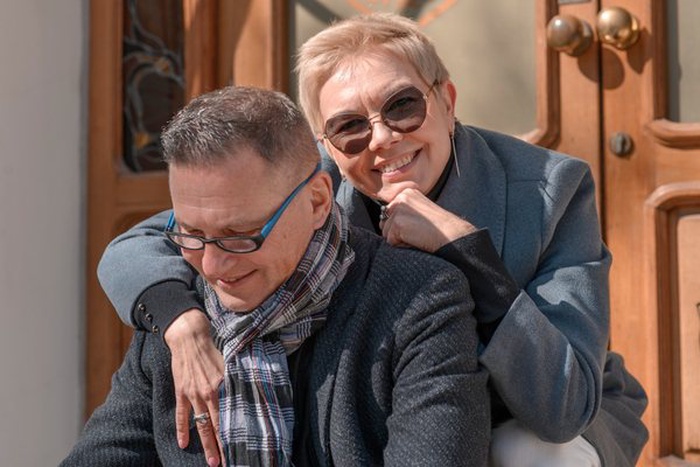 Happy smiling senior couple hugging each other outdoor