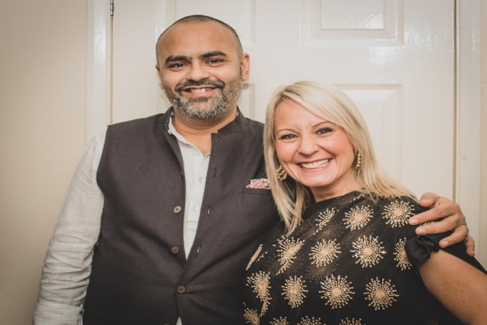 Portrait of smiling couple standing at home