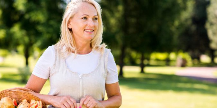 Happy confident woman over 50 smiling outdoors