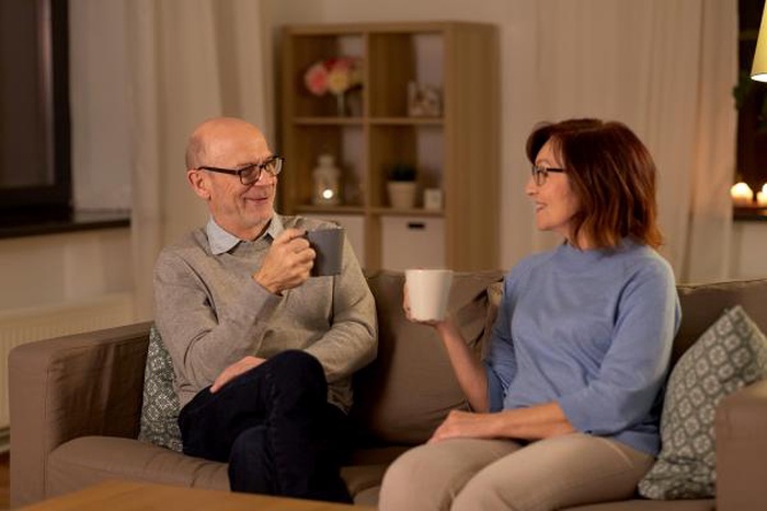 Happy Mature Senior Couple Over 60 Talking At Home