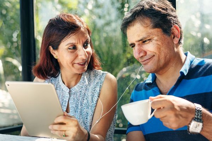 india senior couple are dating in coffee shop
