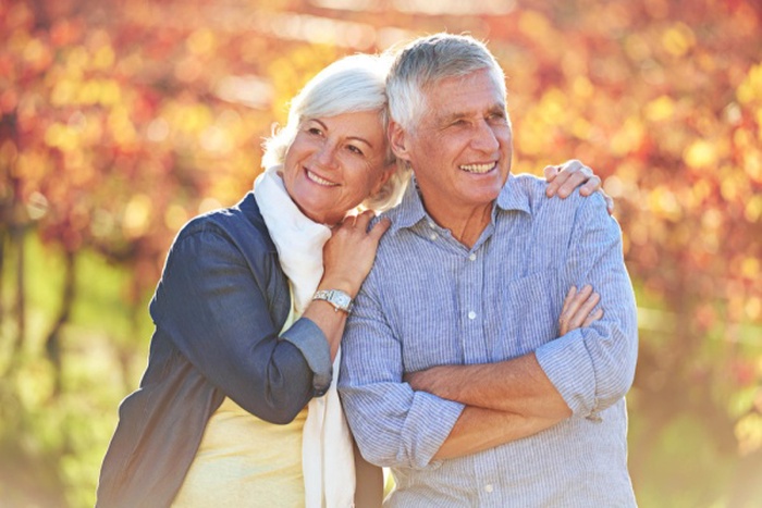 Senior couple nature and love with hug romantic and happy partners marriage vineyard and outside for professional farmers or agriculture relationship and proud retired man with wife in field
