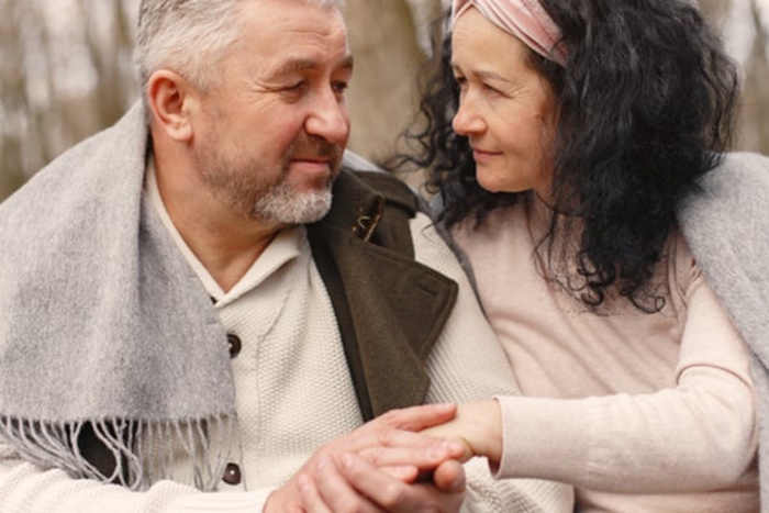 Elegant adult couple in a spring forest