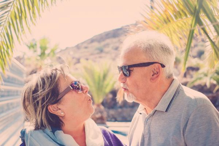 Senior couple romantic tropical vacation moment