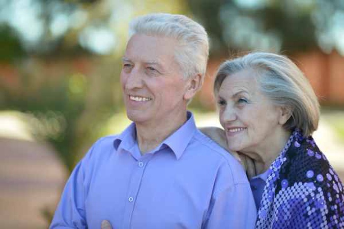 Portrait of a senior couple relaxing near hotel resort