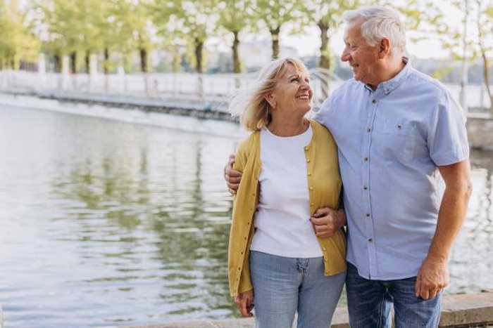 mature couple walking Riverwalk Covered Bridge Littleton New Hampshire
