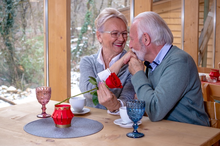  A gentleman with a rose, kissing the hand of his chosen one