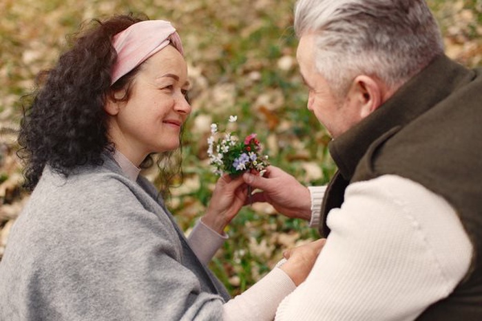 elegant adult couple in a spring forest