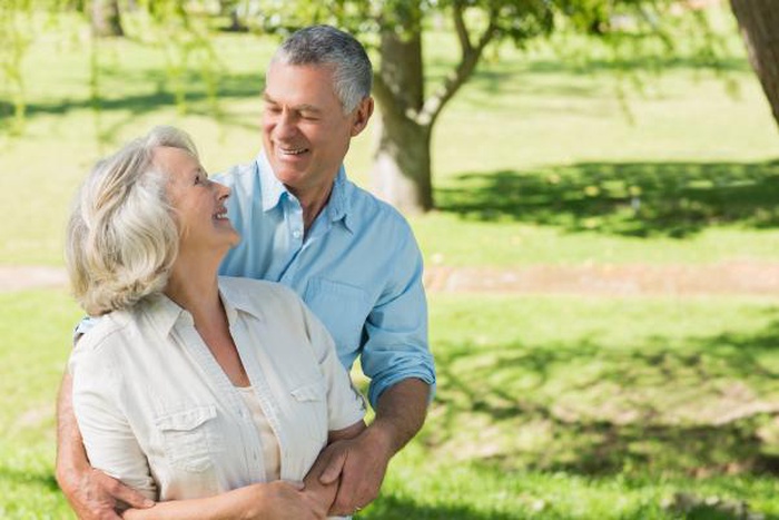 Loving and happy mature couple at park