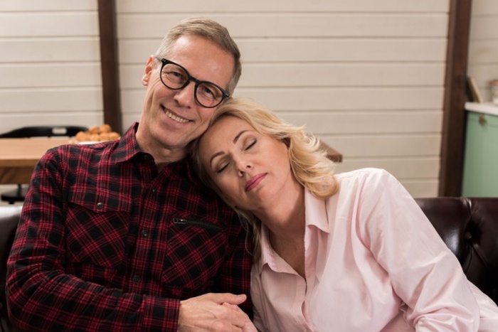 Smiling mature couple at home