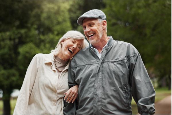 Funny love and laughing with old couple in park for retirement happiness