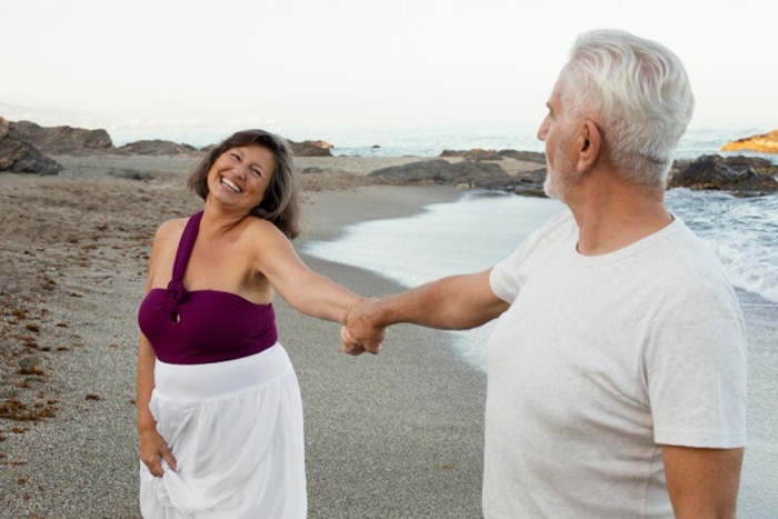 Senior loving couple spending time together at the beach