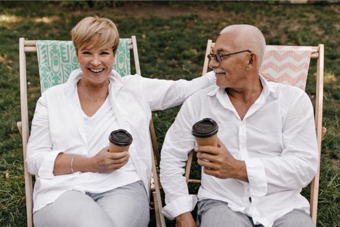 Two happy seniors in Bristol Township enjoying a coffee date outdoors