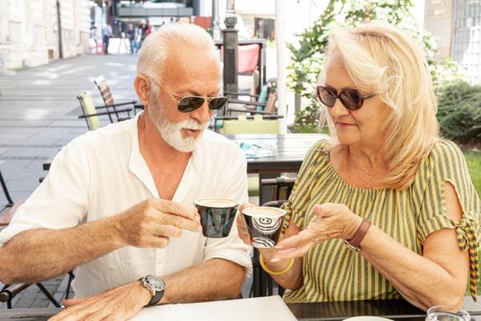 Happy couple drinking coffee together