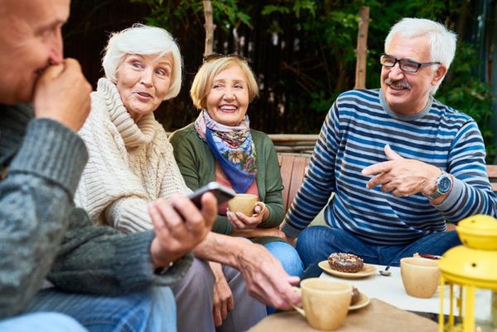 Senior friends together at a cafe