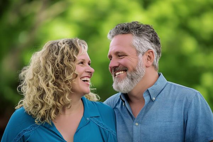 Joyful senior couple sharing a laugh outside