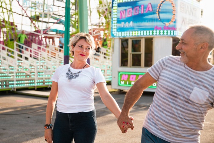 Medium shot cute couple holding hands
