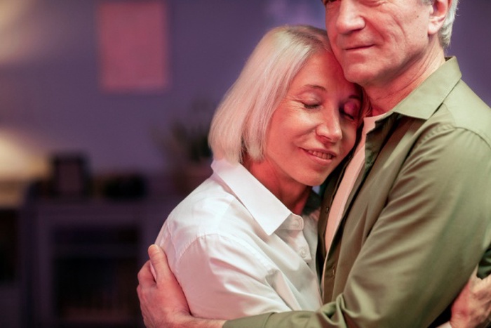 Senior friends having a party at night