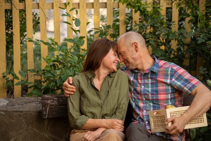 Happy senior couple sharing tender moment outdoors