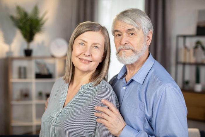 Portrait of cute family couple looking and smiling at camera