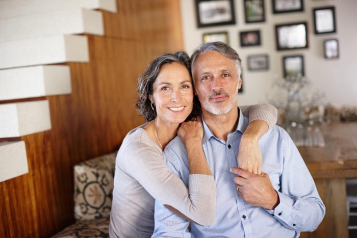 Portrait love and senior couple with a hug retirement and relationship at home romance and marriage face support and old man with mature woman embrace and happiness with romantic and wellness