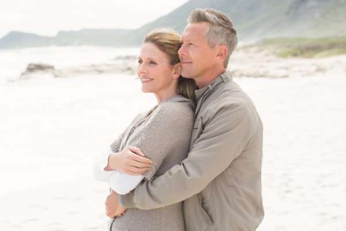  Smiling man holding his partner