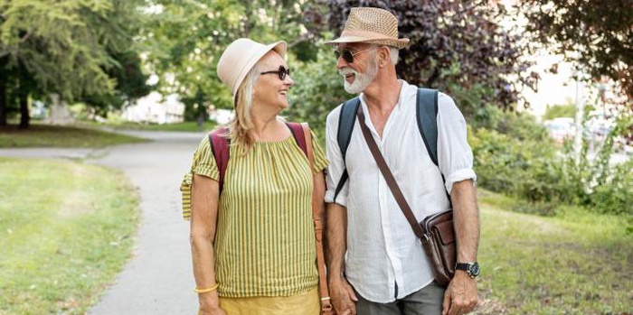 Senior couple walking together in small town