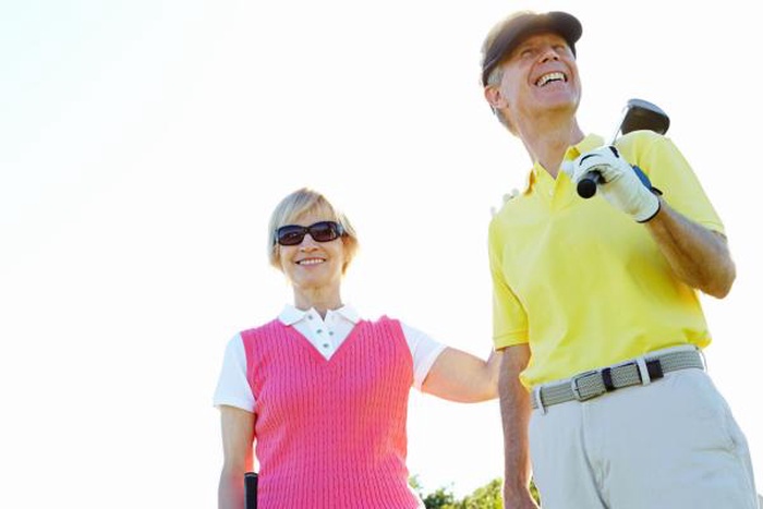 Senior couple enjoying a golf date