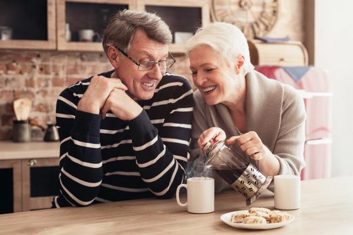 A senior couple is enjoying afternoon tea