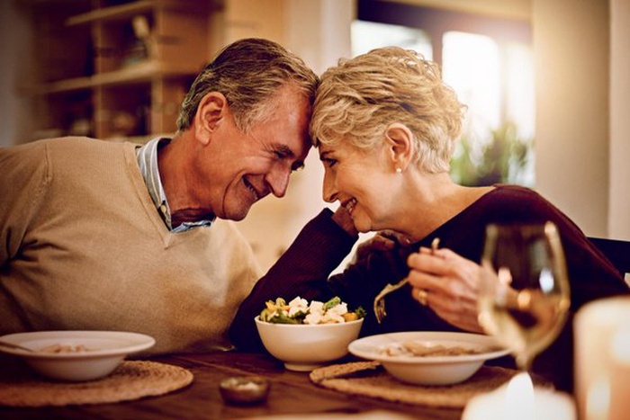 elderly couple enjoying a meal