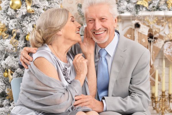 A senior man and woman sitting close, symbolizing honesty, care, and companionship in later-life dating