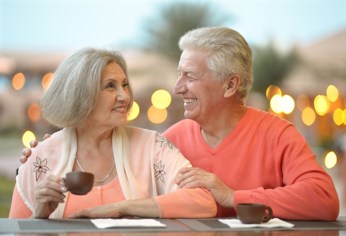 Nice senior couple with coffee on vacation