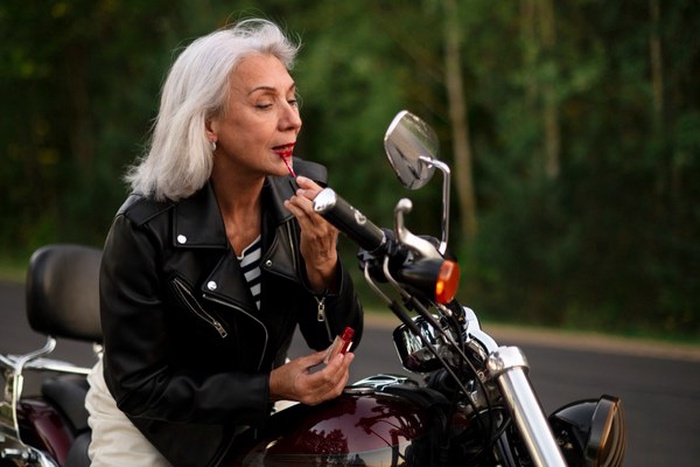 senior woman with motorcycle