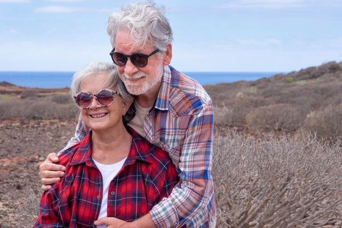 beautiful couple of senior travelers
