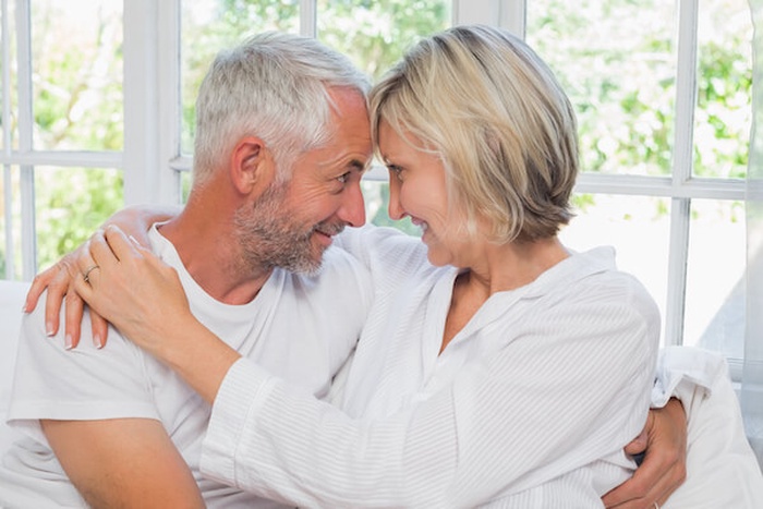 Loving happy senior couple with arm around