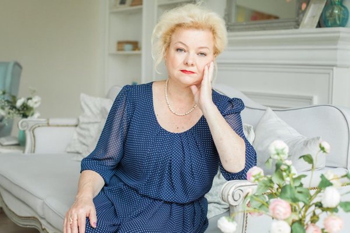 Portrait of blonde older woman at home 60 years old