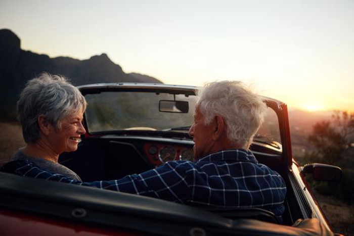 Senior couple on a sunset road trip date