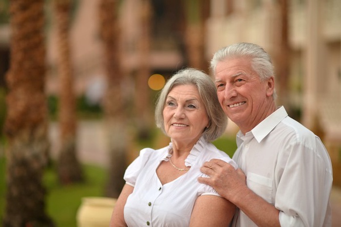 Happy Mature couple in love enjoy fresh air and stunning view on vacation