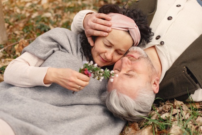 r Elegant adult couple in a spring forest