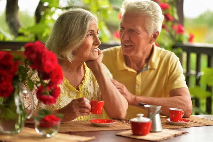 happy senior couple drinking coffee