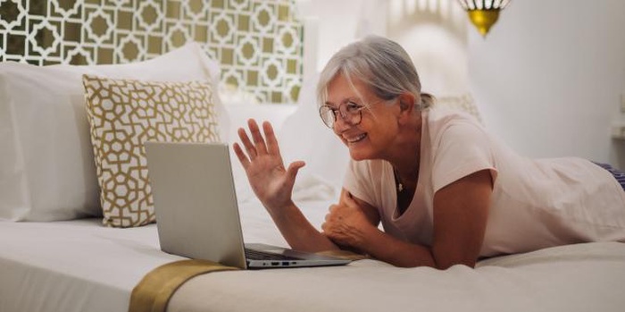 Senior women smiling on video call at home