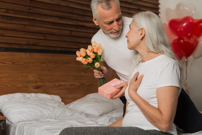 Senior man surprising wife on valentines day