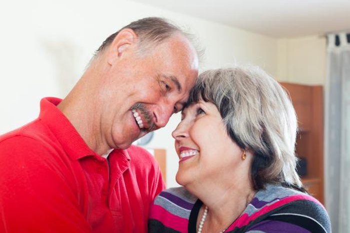 Happy elderly couple sharing a sweet