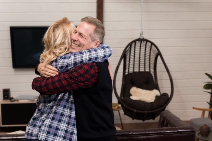  Parents posing while embraced